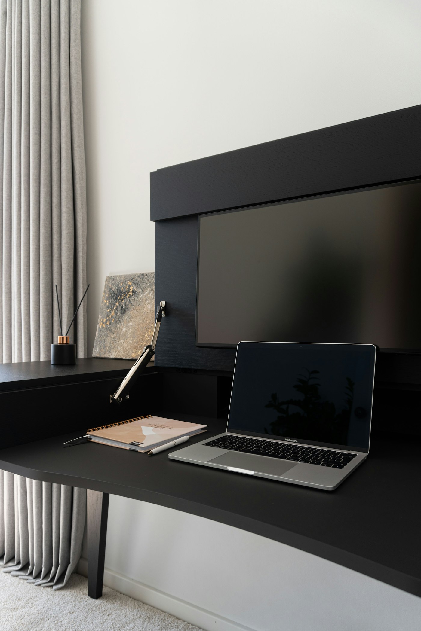 Laptop and monitor arranged in a home office